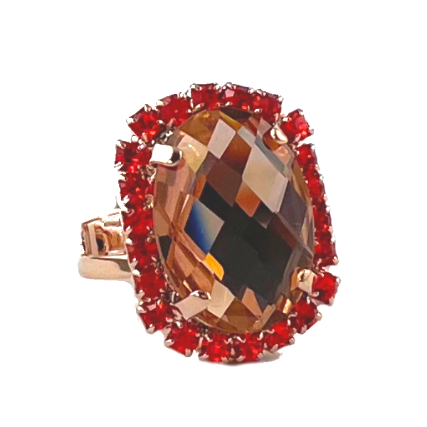 Image of dress ring featuring large oval clear champagne Swarovski crystal trimmed with orange crystals. 18ct rose gold plated band.