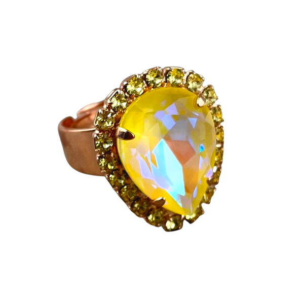 Image of dress ring featuring large yellow teardrop Swarovski crystal trimmed with yellow seed crystals. 18ct rose gold plated band.