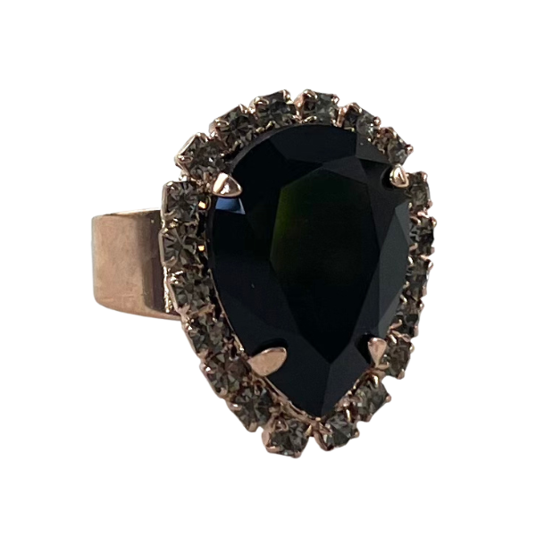 Image of dress ring featuring large black teardrop Swarovski crystal trimmed with diamond seed crystals. 18ct rose gold plated band.