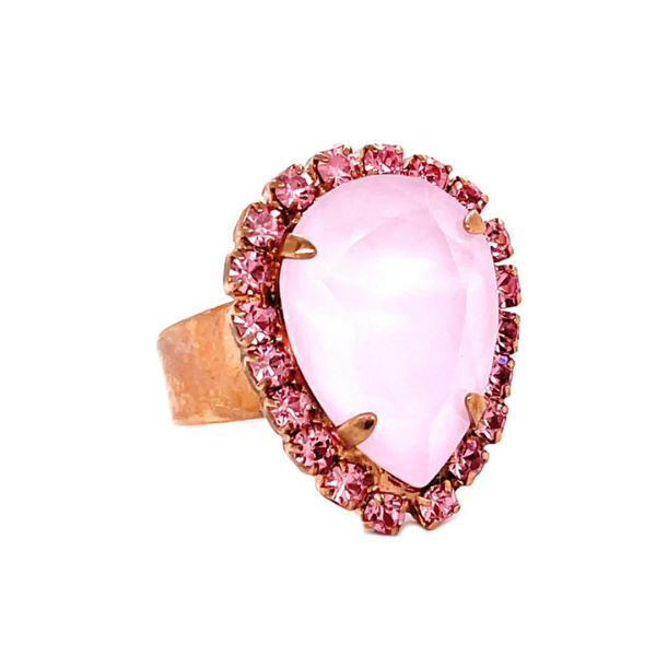 Image of dress ring with large pale pink teardrop crystal edged with soft pink small crystals.