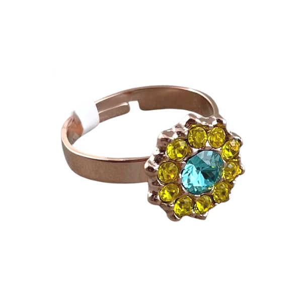 Image of adjustable ring with blue and yellow crystals set on 18ct rose gold plated metal.