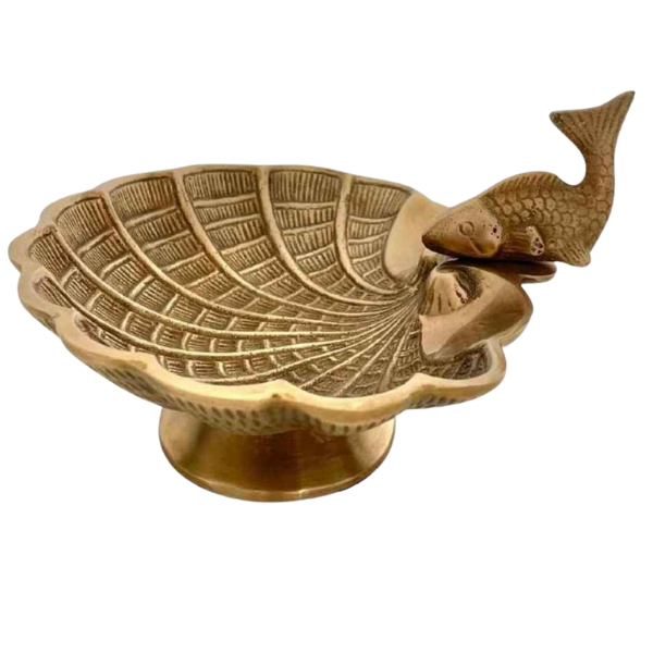 Image of brass shell shaped dish with fish feature.