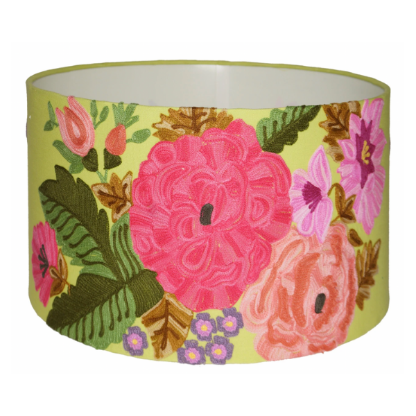 A delightfully attractive drum lampshade on a crips lime cotton/linen base overlayed with multicoloured embroidered, fuchsia, pink and peach peonies trimmed with green leaves.