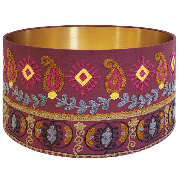 Image of purple cotton lampshade with tribal paisley pattern in purple, blue and yellow embroidery.