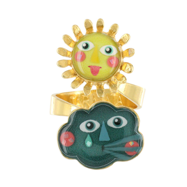 Image of gold metal ring with sun and cloud happy faces as centre piece.