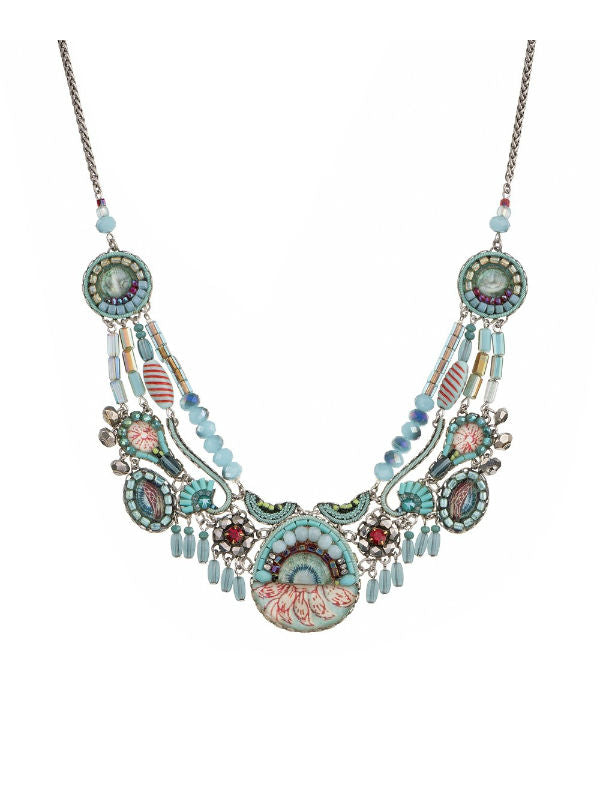 Image of multi layered necklace made skillfully by hand using aqua blue and red coloured textiles, glass and metals.